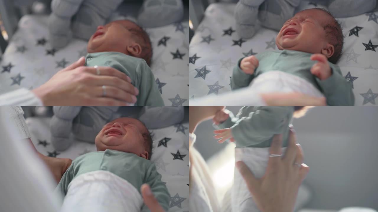 4k视频片段，一名妇女捡起哭泣的婴儿