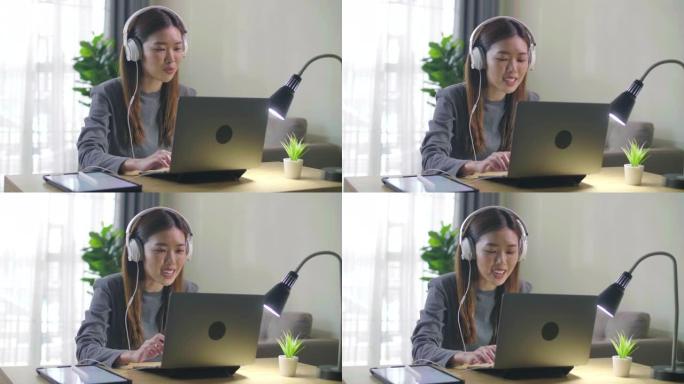 年轻的亚洲女性自由职业者使用笔记本电脑与客户合作视频会议