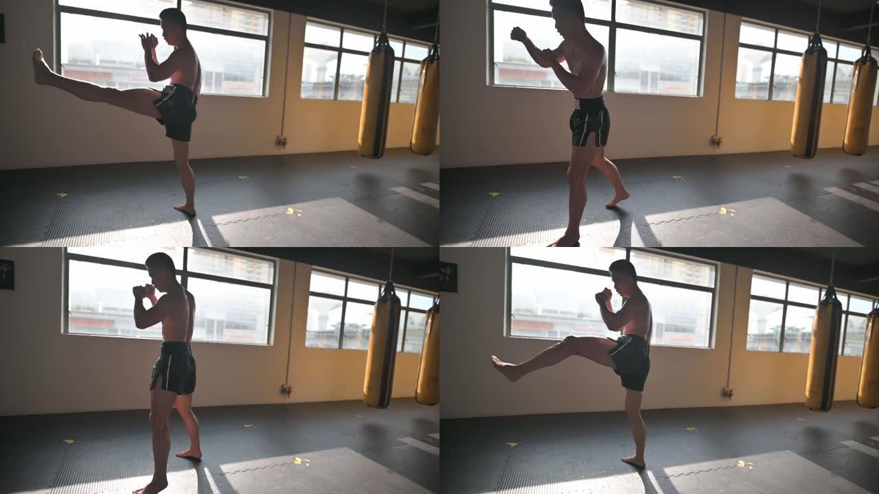 影子拳击亚洲中国泰拳拳击手在健身房练习拳击空气
