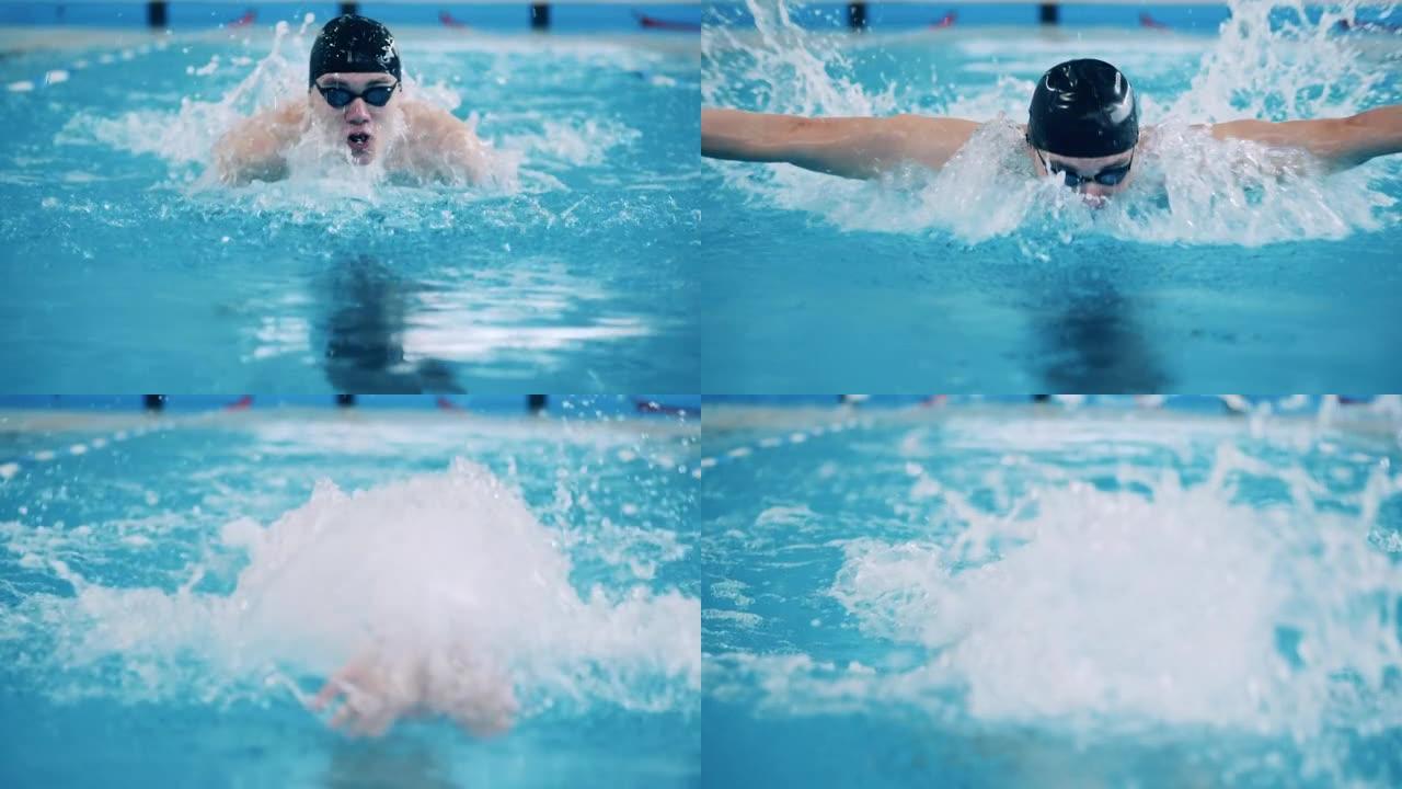 男性游泳运动员在慢动作穿越游泳池时潜水