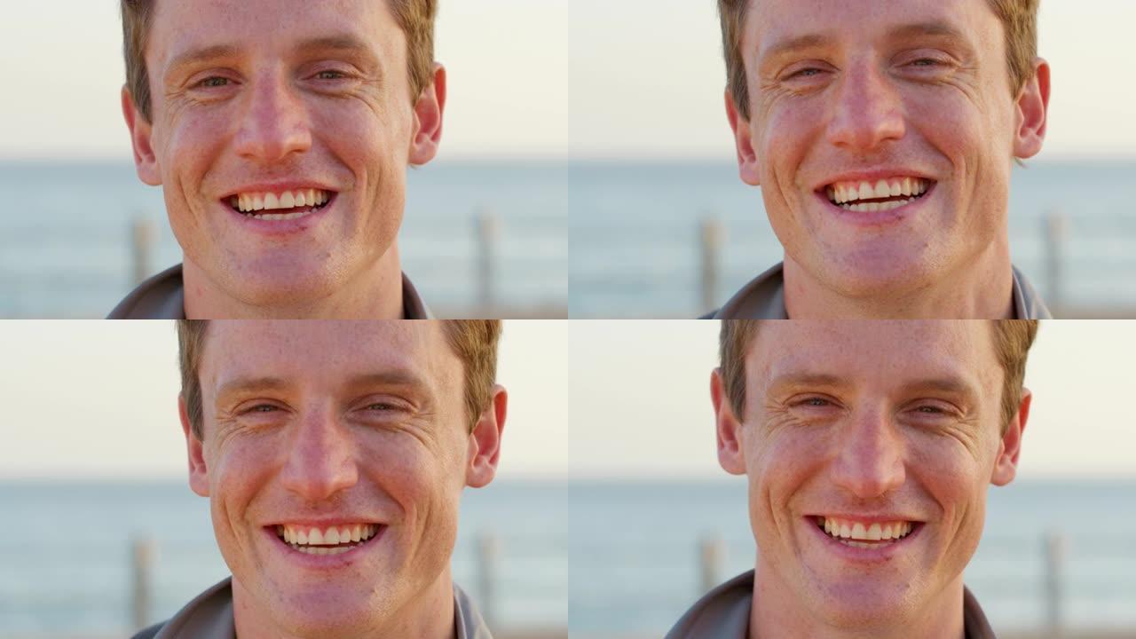 男人，脸上和微笑的肖像在海滩上度过快乐的旅行假期或户外暑假。在蓝天背景下的阳光，海浪和水中，滑稽，大