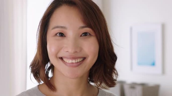 肖像美丽的亚洲女人微笑着看起来快乐感觉积极自信的女性美女4k镜头