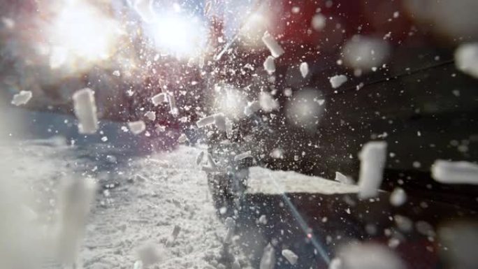 特写: 未知的汽车在试图在雪地上获得牵引力时旋转车轮。