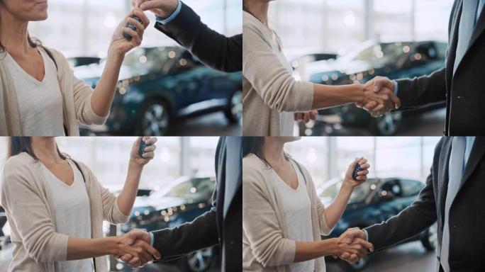 SLO MO汽车推销员将新车的钥匙交给了一个女人