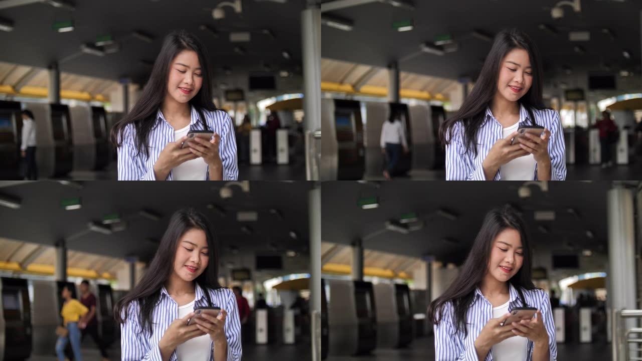 使用智能手机的年轻亚洲美女