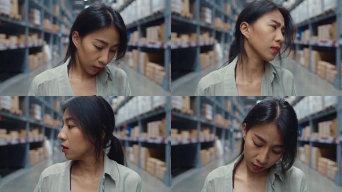 不高兴的年轻亚洲女商人经理在零售购物中心站着，感到困惑和困惑，挠头，表示怀疑。
