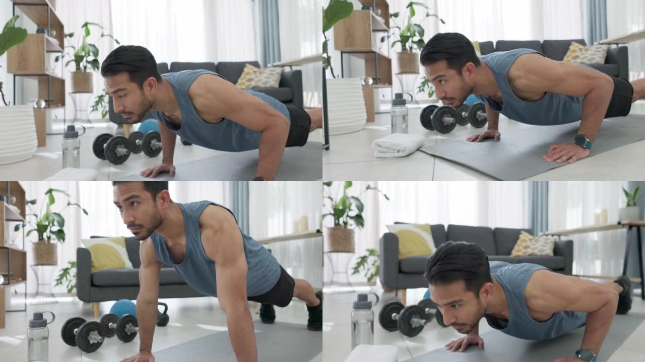 在家锻炼，强壮的男人在地板上锻炼在客厅和推举训练肌肉。健康的生活方式，减肥和力量动力。运动健康，表现