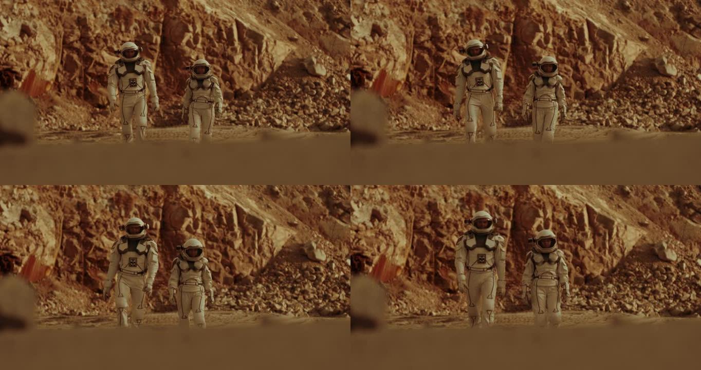 在火星上行走的男女宇航员