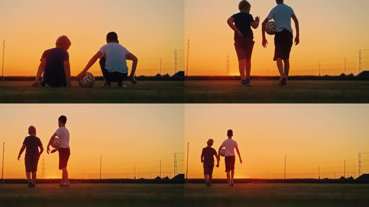 慢动作男孩与足球在黄昏时一起在田野里散步
