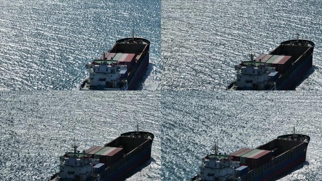 鸟瞰集装箱货船承运集装箱抵达进出口概念