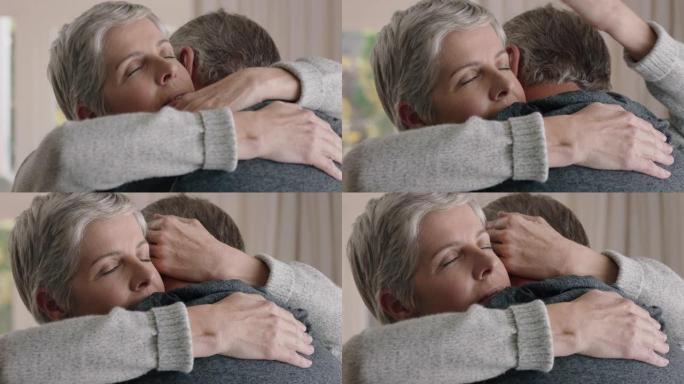 悲伤的成熟女人拥抱丈夫向情绪激动的妻子夫妇分享坏消息拥抱压力大的退休婚姻问题4k镜头