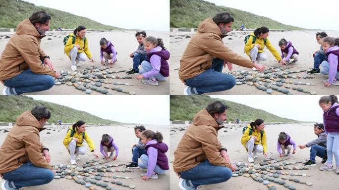在沙滩上制作艺术石头石子沙滩