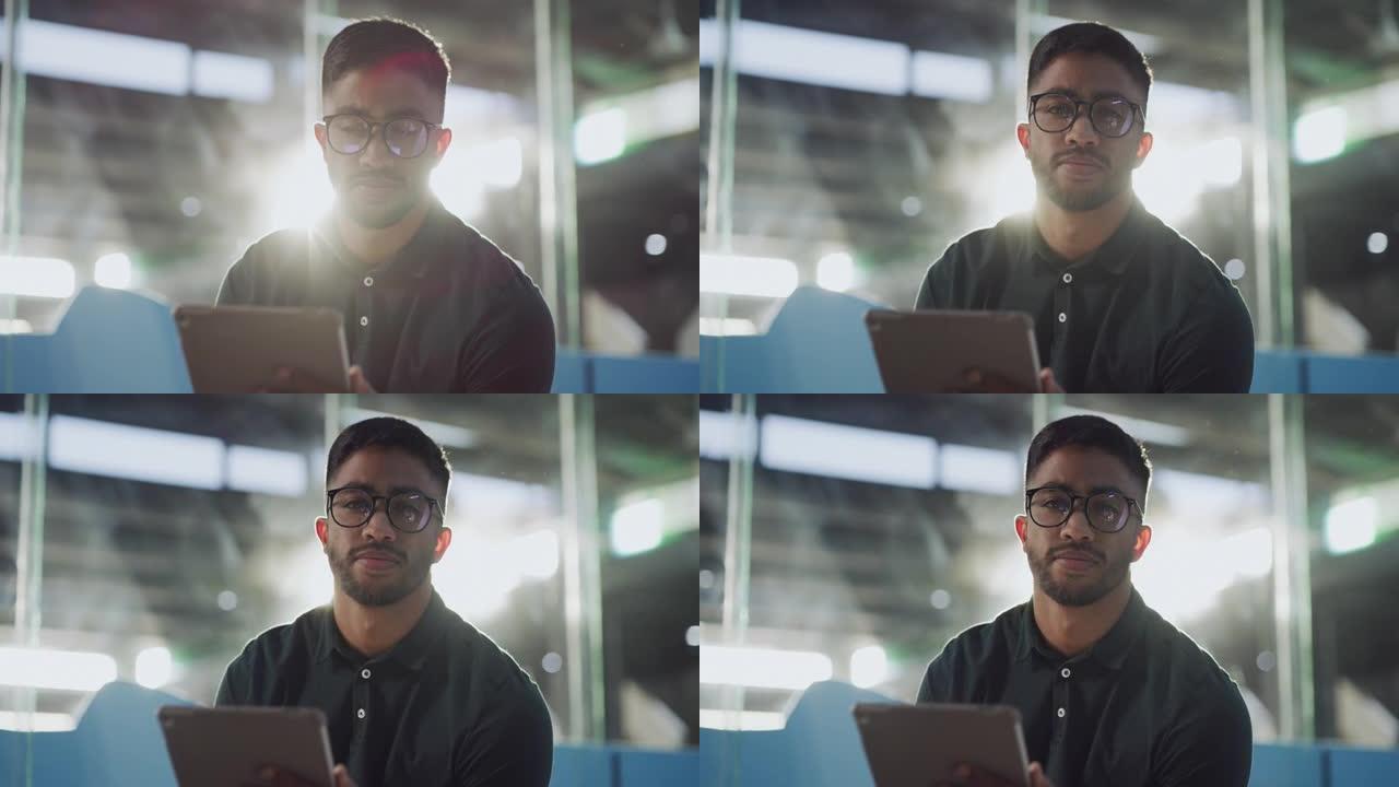 4k视频片段，一个英俊的年轻人独自坐在动物收容所中并使用数字平板电脑