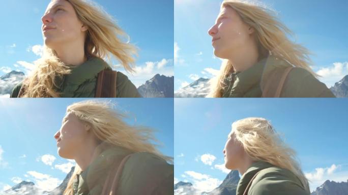 4k视频片段，一个迷人的女人在m ø re og Romsdal远足时欣赏山景