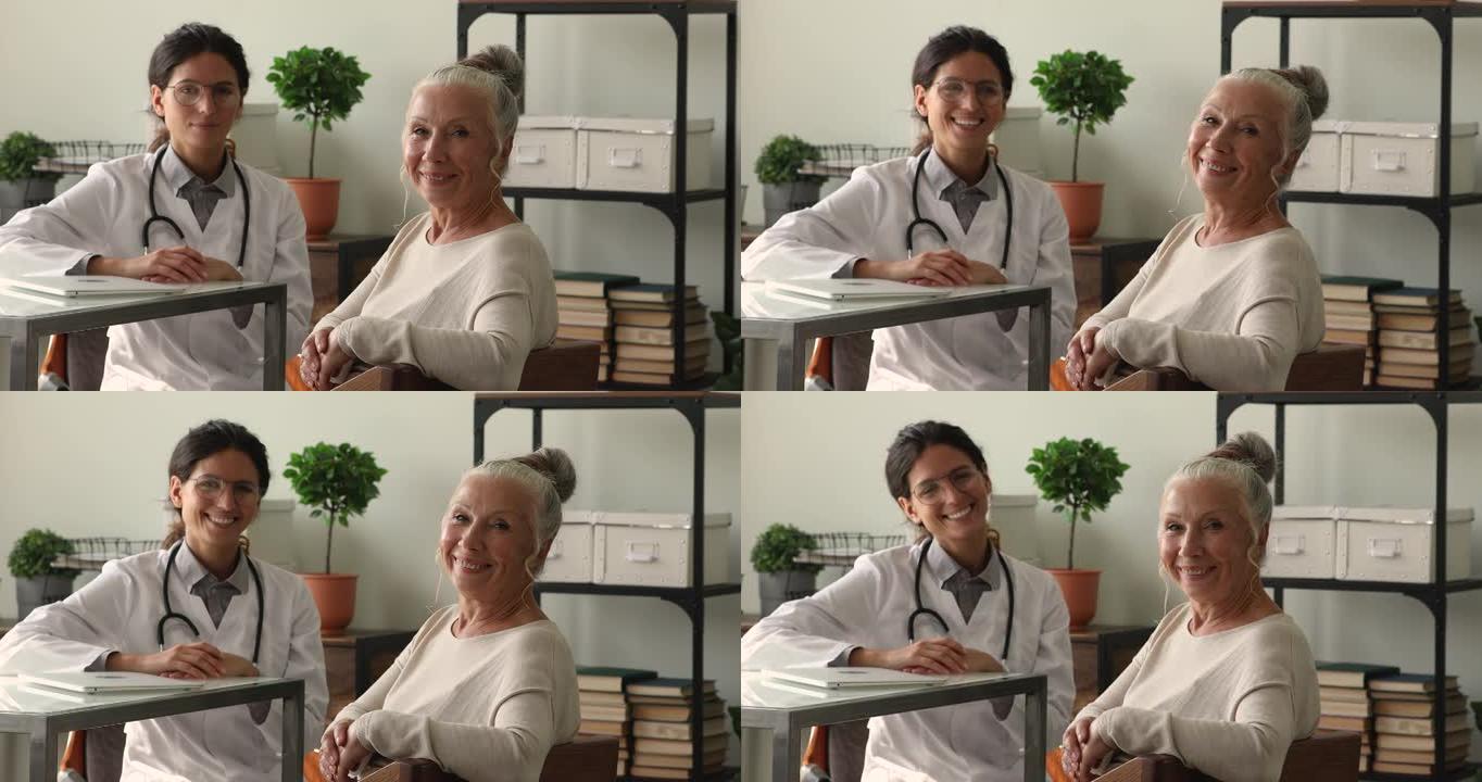 快乐的60多岁妇女与微笑的年轻医生合影。