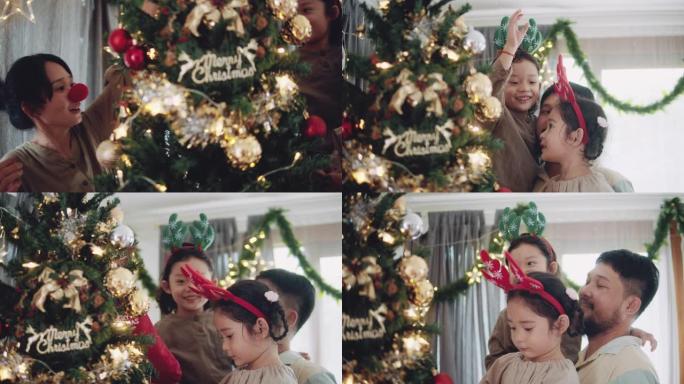 装饰圣诞树的快乐家庭。