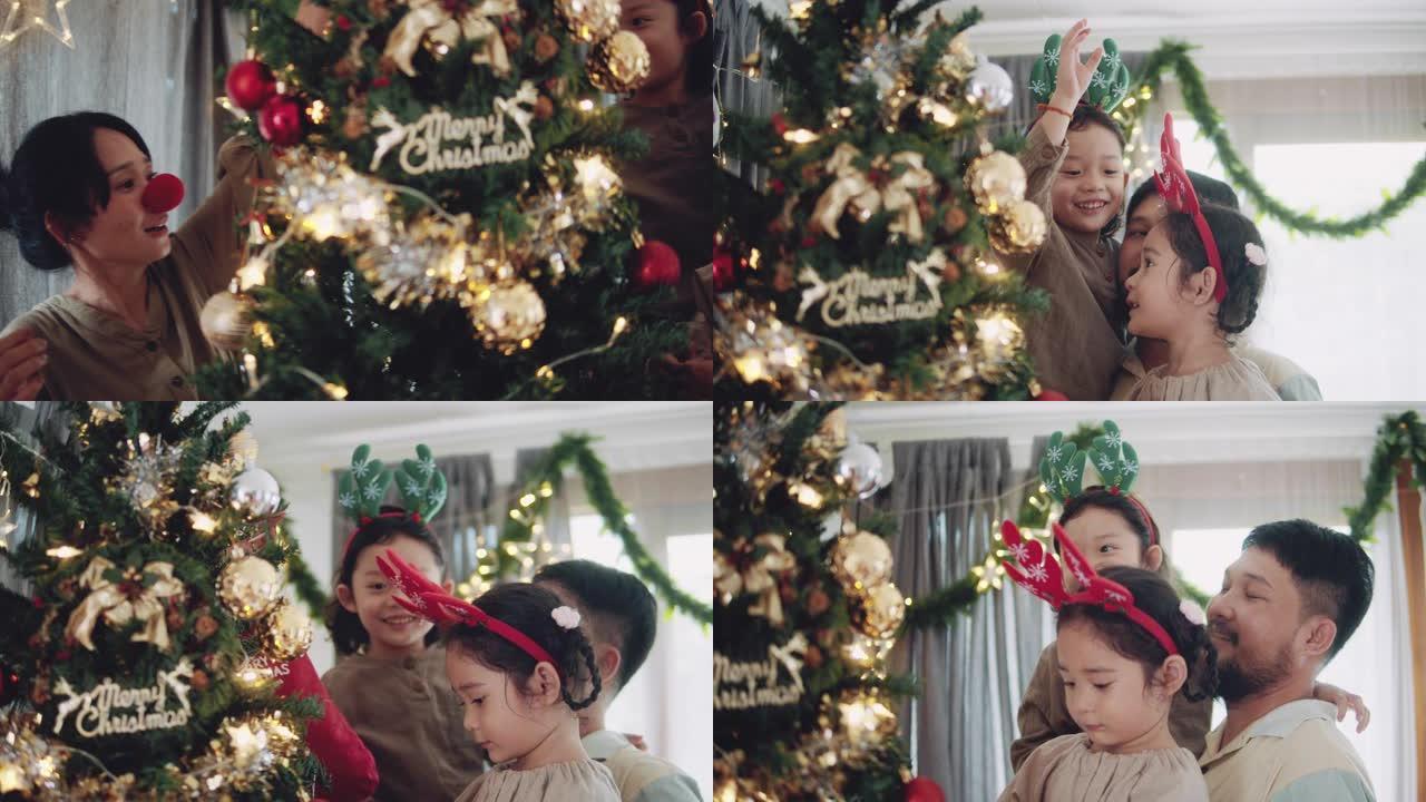 装饰圣诞树的快乐家庭。