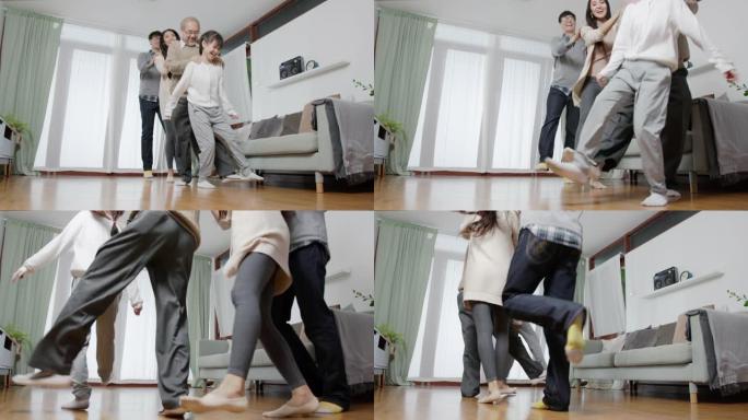 亚洲家庭趣味舞蹈好温暖时间派对游戏检疫活动。