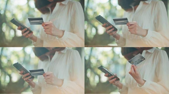使用信用卡在智能手机上购物的女性