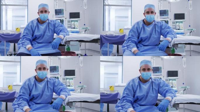 在医院的手术室里戴着口罩的白人男性外科医生的肖像