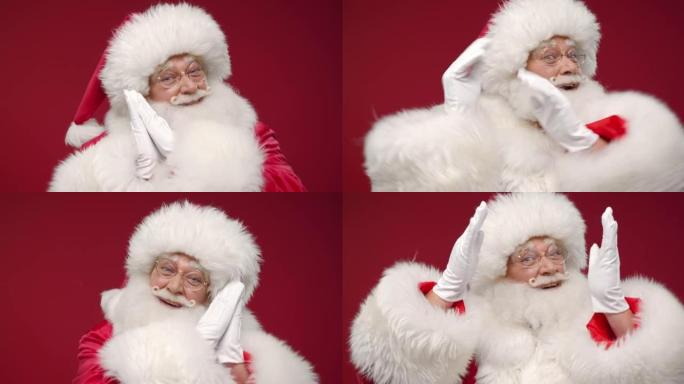 一个快乐的圣诞老人在红色背景下在相机上跳舞的特写镜头