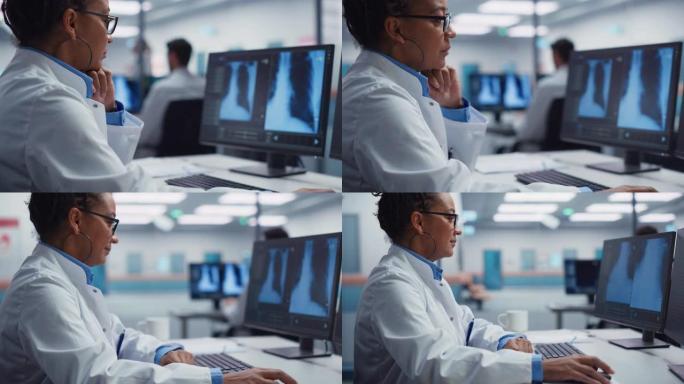现代医院实验室: 黑人女医生正在计算机分析屏幕上的胸部，骨骼x射线。从事高科技治疗研究的非裔美国专业