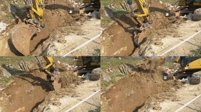 特写: 黄色挖掘机在建筑工地附近挖了一条深沟。