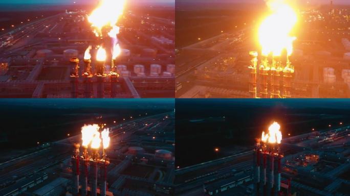 天然气在夜间被炼油厂的火炬堆烧毁