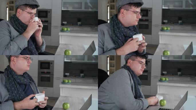 男人在电脑上喝茶休闲生活思考居家办公
