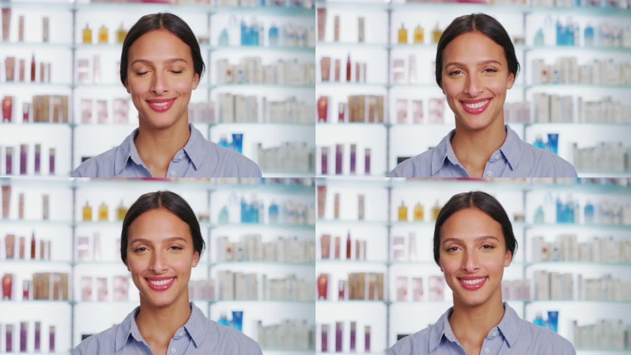 一位拥有完美皮肤的年轻女子在药房背景下的相机中微笑。