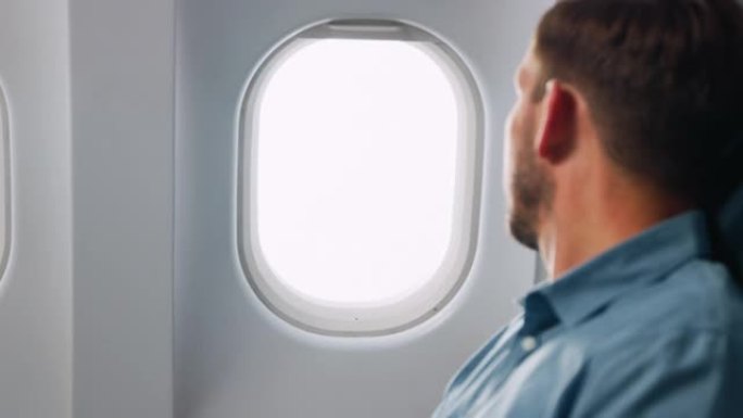 飞机窗打开飞机窗户开窗通风商务人士坐飞机
