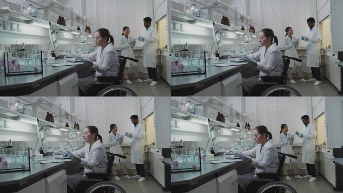 在实验室工作的轮椅上的女科学家