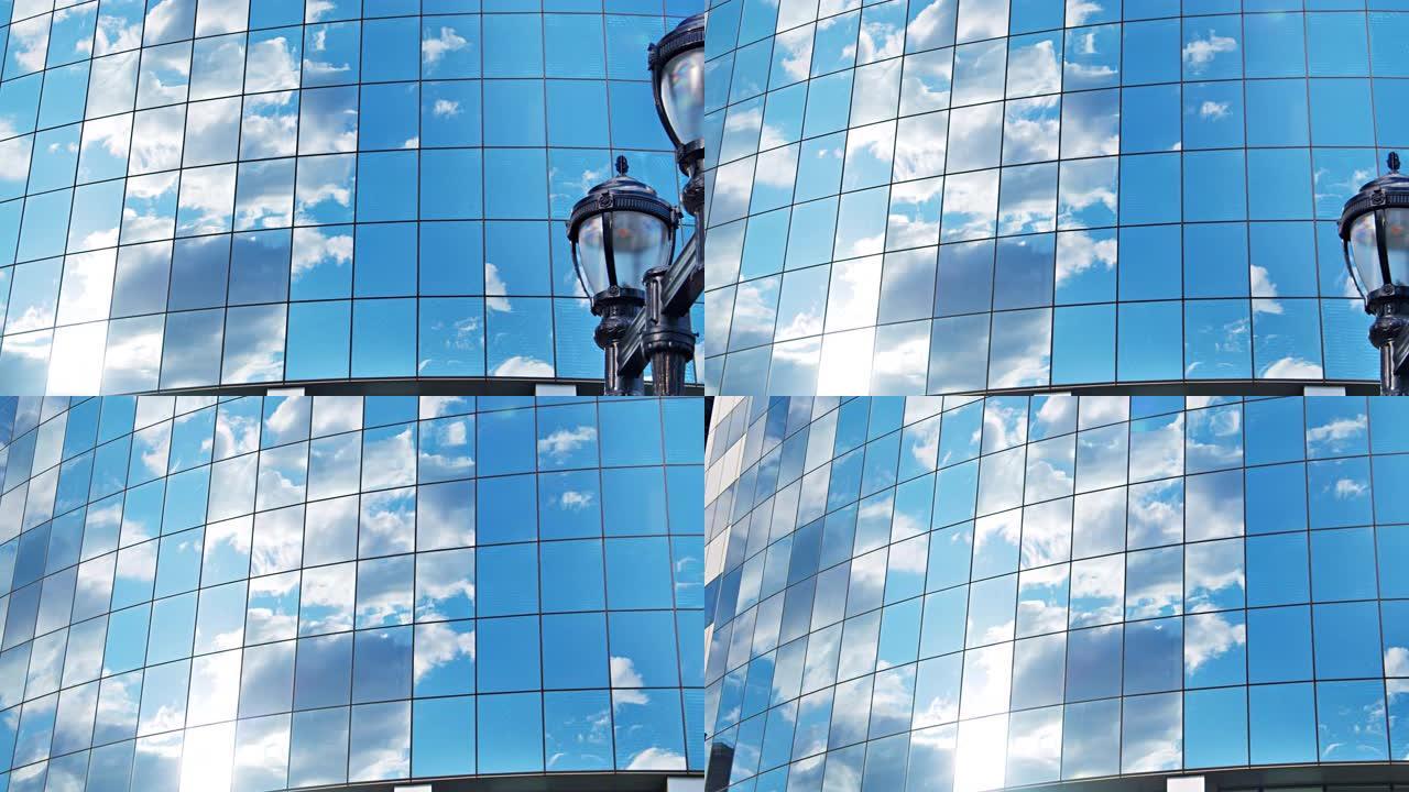 企业建筑玻璃窗的概念观。天空，云，太阳反射