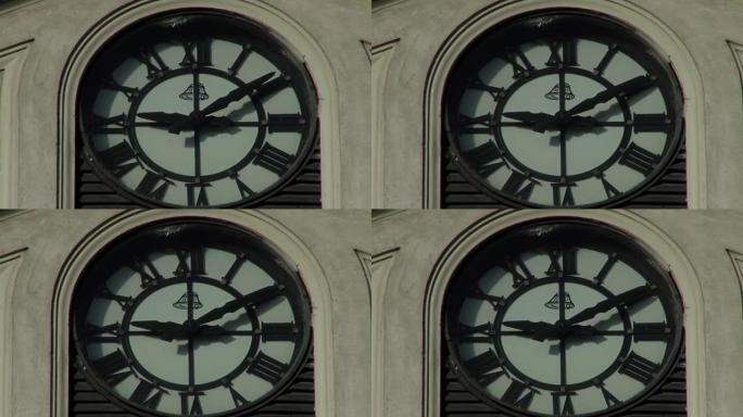抬头看着布宜诺斯艾利斯蒂格雷一栋旧市政建筑立面上的古董钟。特写。
