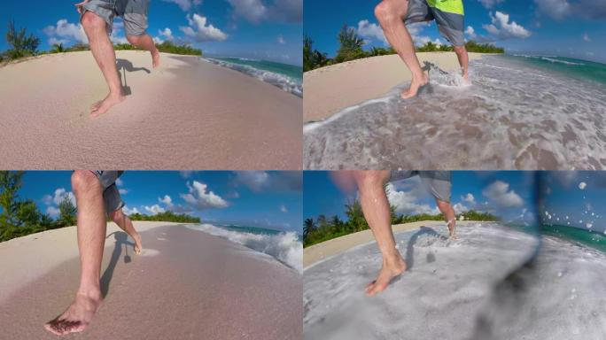 低角度: 无法识别的男性游客赤脚沿着热带海滩奔跑。