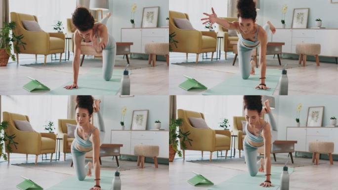 瑜伽，平板电脑和在线视频的女人在她家的客厅进行伸展运动。在网上进行健身锻炼时保持平衡的女孩，家里的休