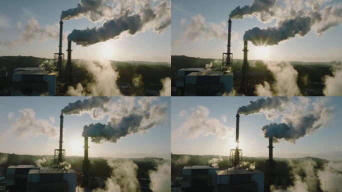 污染。气候变化。环境破坏。日出时烟雾堆中排放的温室气体的壮观近距离空中平移视图