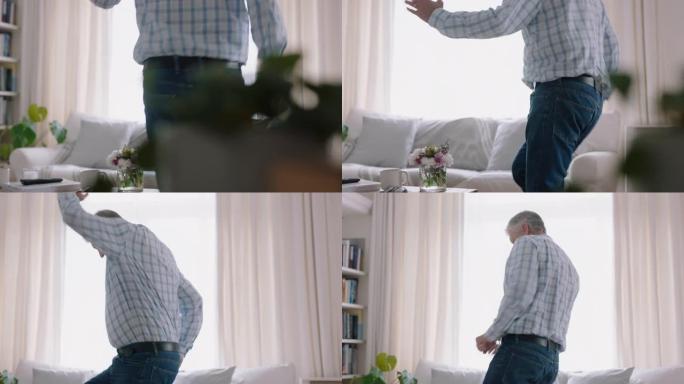 快乐的老人在家跳舞庆祝退休，有趣的舞蹈享受生活方式成就4k镜头