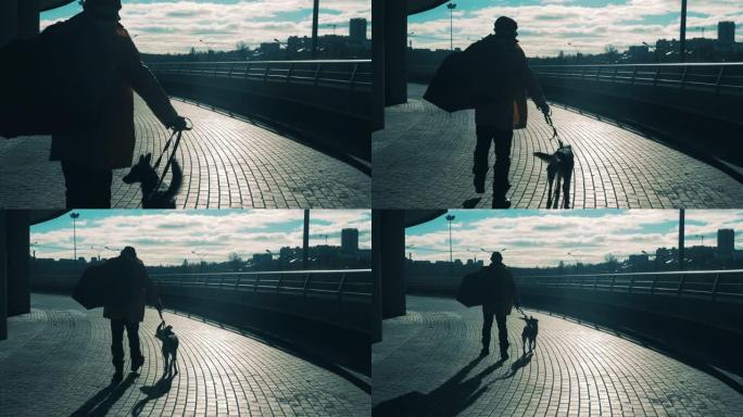 一个流浪汉正带领他的狗沿着城市街道