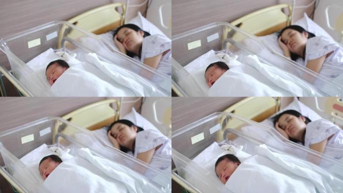 亚洲母亲与新生婴儿在医院睡觉