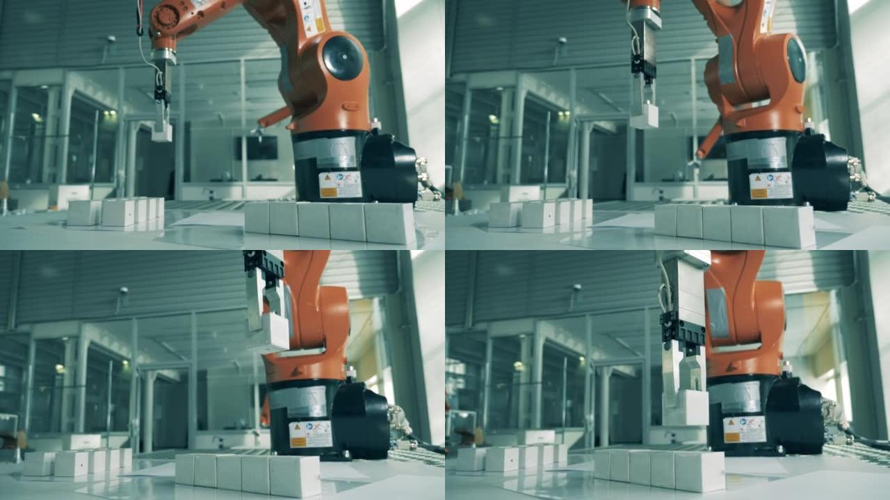 机械臂在现代实验室运送小物体。工业机器人机械手与立方体一起工作。