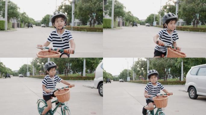骑自行车的快乐男孩。