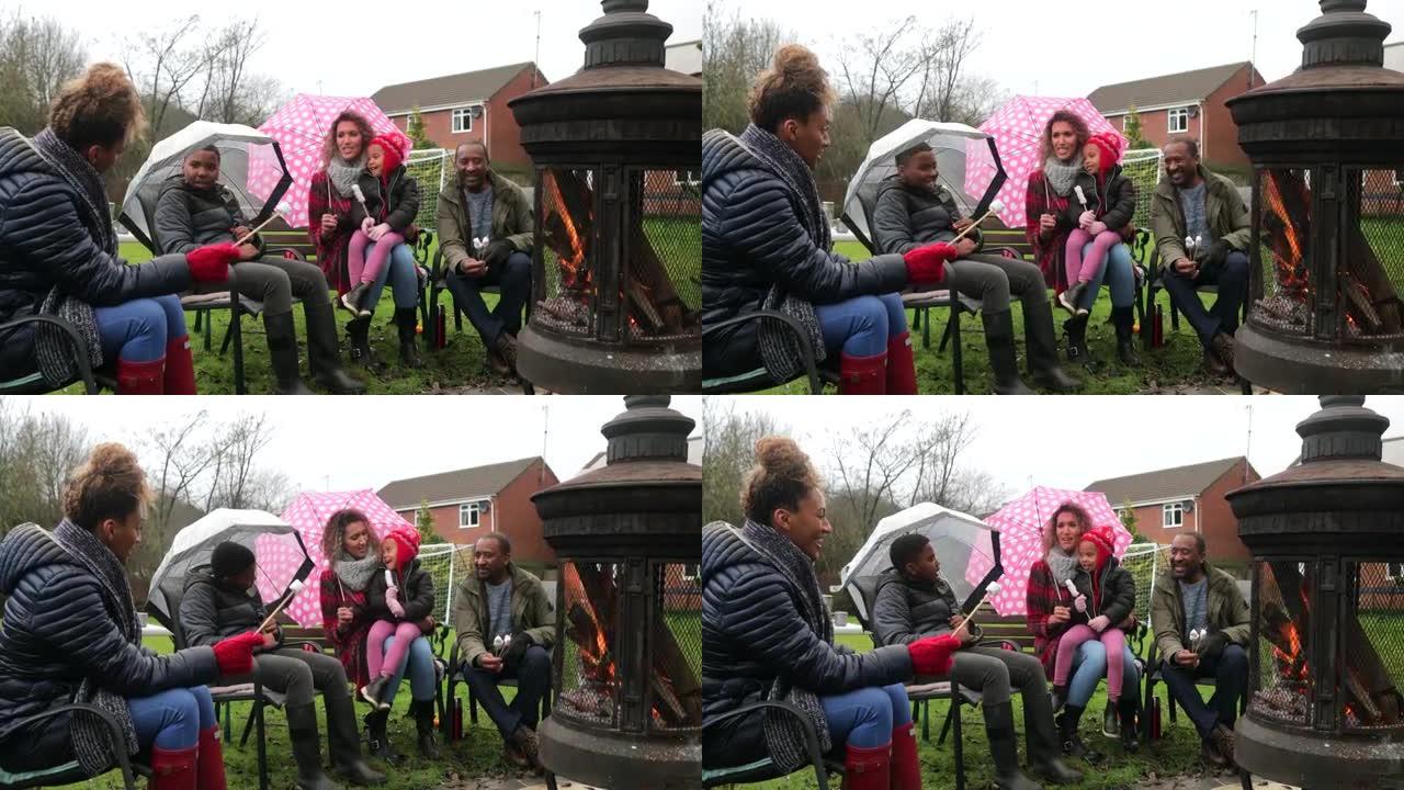 家人坐在火炉旁家人坐在火炉旁篝火外国人