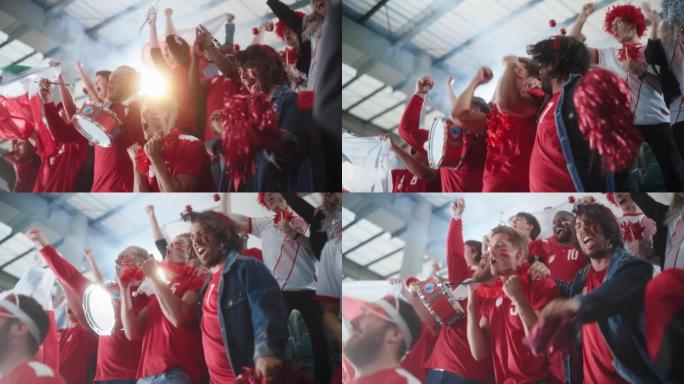 体育体育场事件: 一群球迷为他们的红色足球队获胜而欢呼。人们庆祝进球，冠军胜利。一群画脸的朋友欢呼，