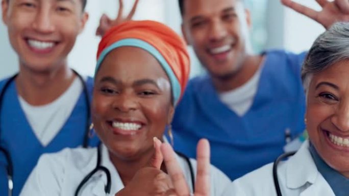 竖起大拇指，和平与成功的医生面对，快乐的团队合作，并感谢您在医院。医疗保健，医疗员工的动机和多样性肖