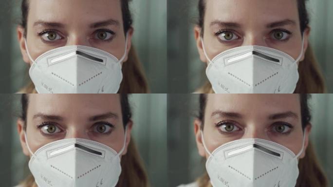 电影微距镜头，女药师顾问脱下N95防护口罩，在镜头前微笑。新冠肺炎概念、防护、冠状病毒、安全、保健。