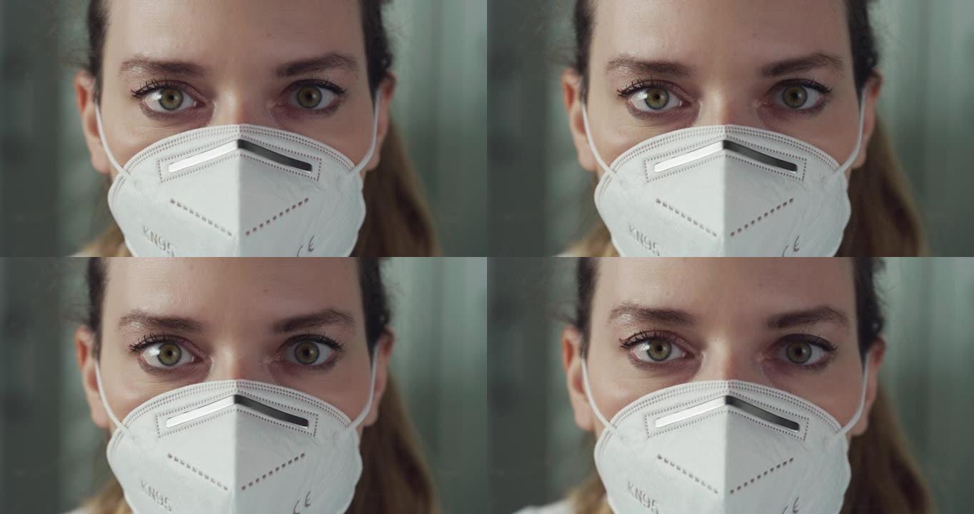 电影微距镜头，女药师顾问脱下N95防护口罩，在镜头前微笑。新冠肺炎概念、防护、冠状病毒、安全、保健。