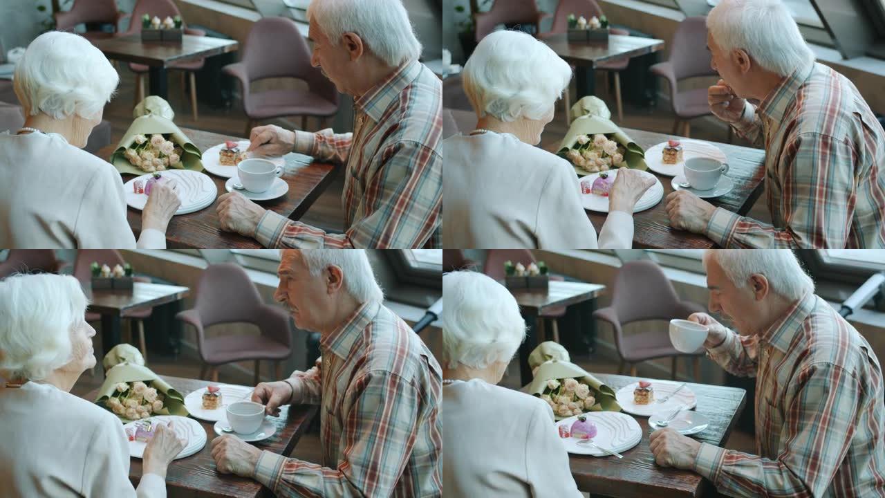 欢乐家庭老人男女在餐厅吃蛋糕喝茶