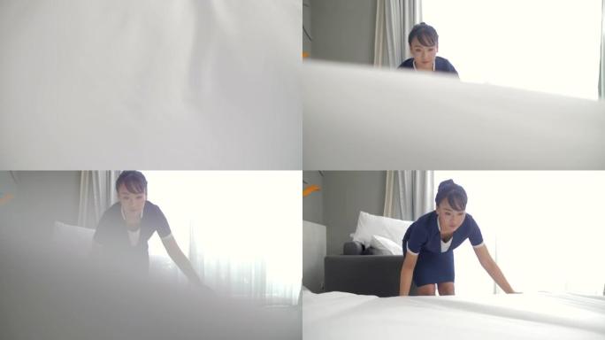 管家在酒店铺床女士铺床打扫