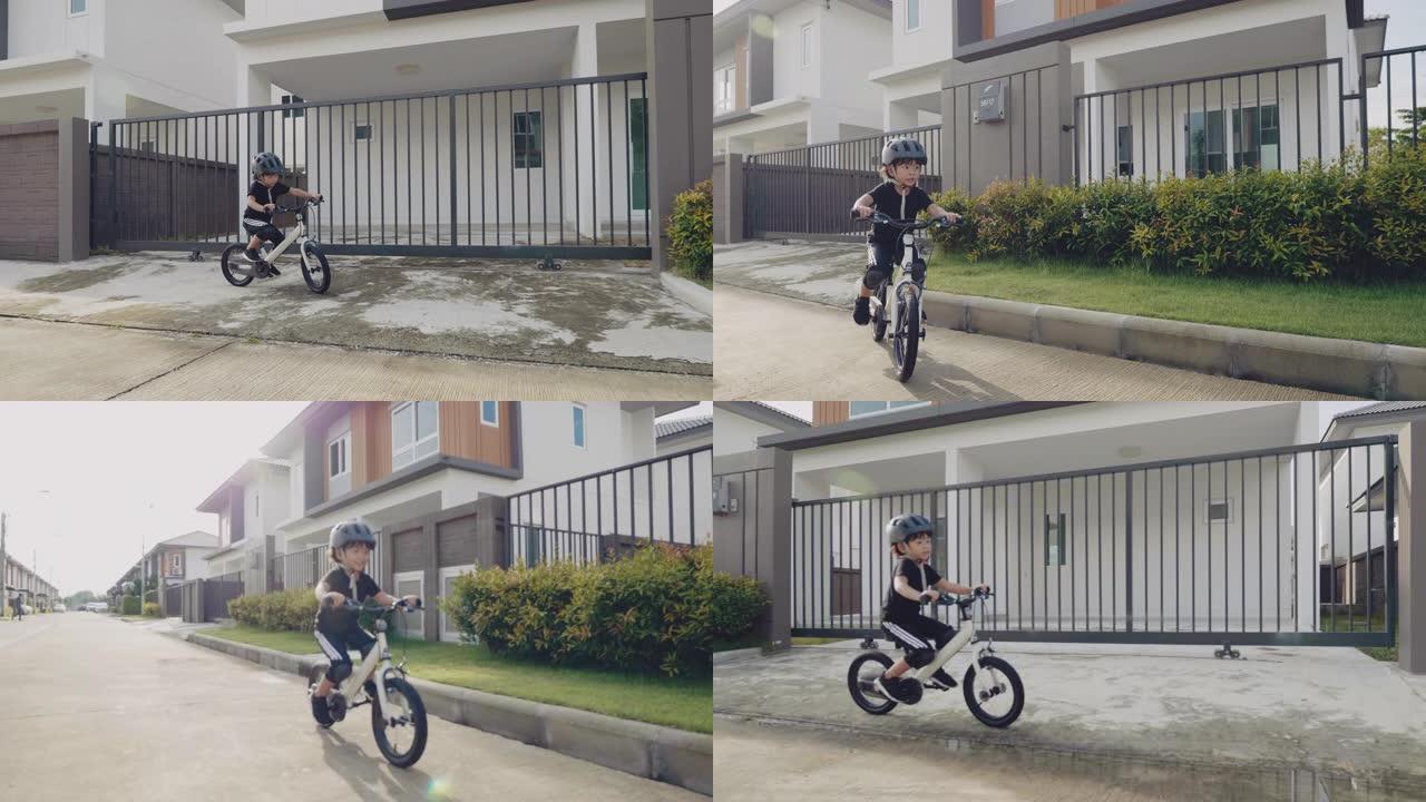亚洲男孩骑自行车。